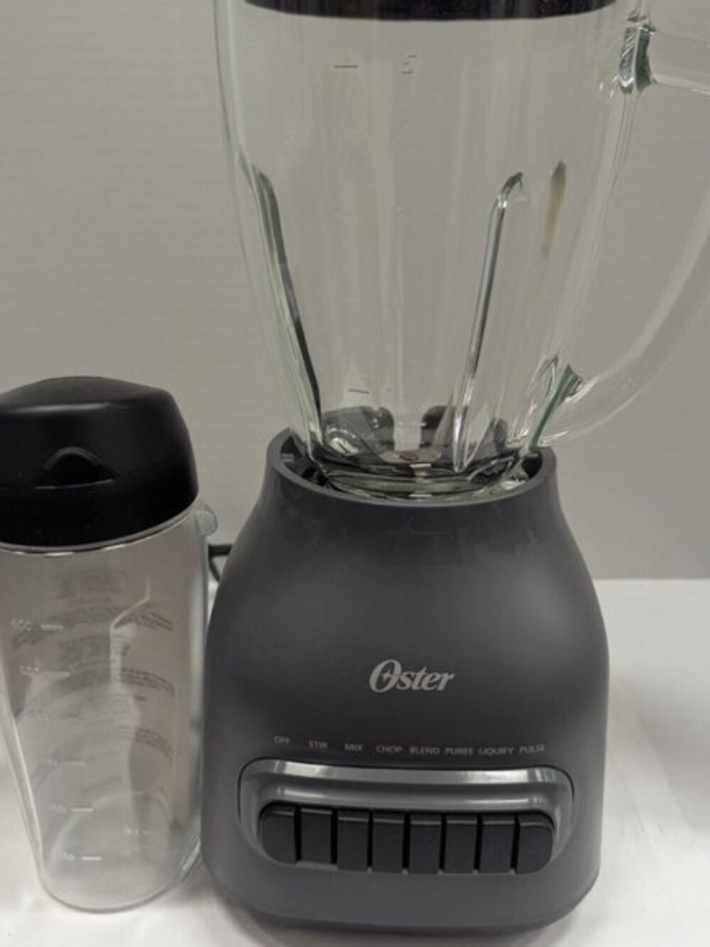 Oster Easy to Clean 700 Watt Blender with 20 Ounce Blend-N-Go Cup in Grey - Picture 2 of 7